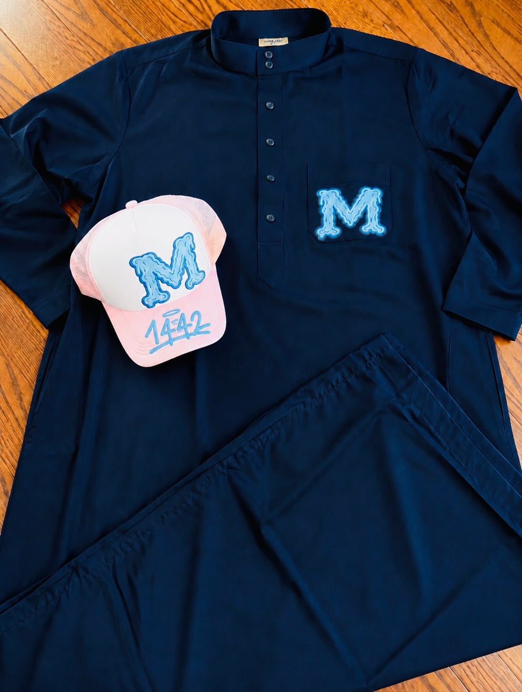 M collection trucker hat